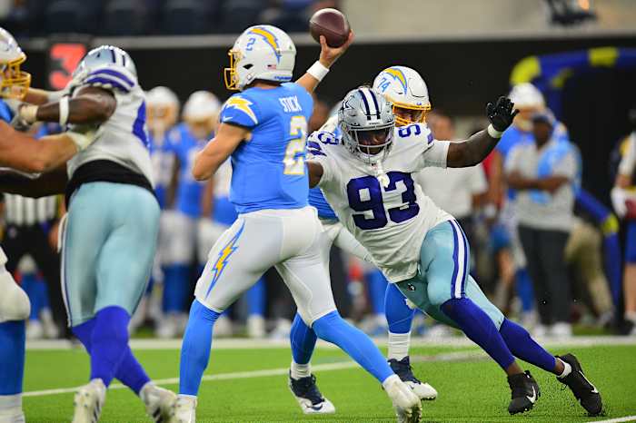 Aug 20, 2022; Inglewood, California, USA; Dallas Cowboys defensive end Tarell Basham (93) moves in against Los Angeles Chargers quarterback Easton Stick (2) during the first half at SoFi Stadium. Mandatory Credit: Gary A. Vasquez-USA TODAY Sports